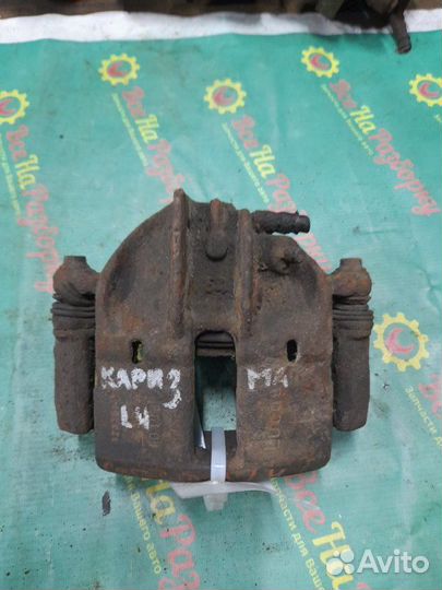 Суппорт передний левый Mitsubishi Carisma седан