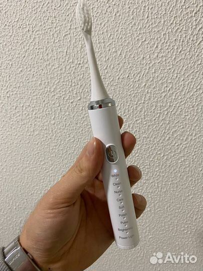 Электрическая зубная щетка