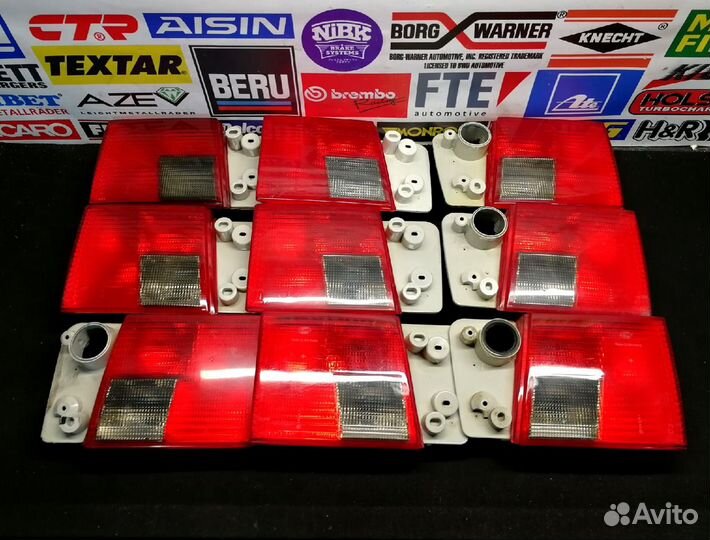 Фонари задние audi А6C4 hella в крышку багажника