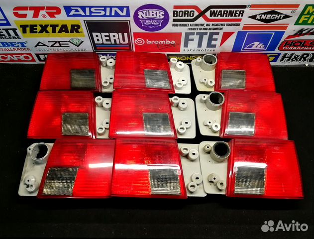 Фонари задние audi А6C4 hella в крышку багажника