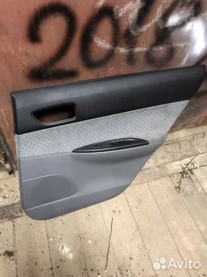 Обшивка двери Мазда 6