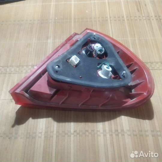 Фонарь заднего хода задний левый Mitsubishi Lancer