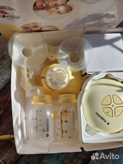 Молокоотсос двойной medela swing maxi