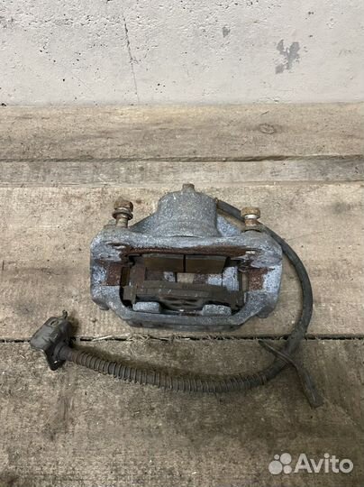 Суппорт тормозной передний левый Kia Cerato