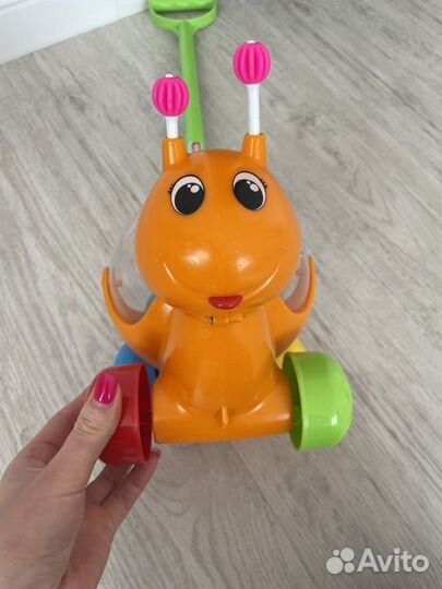 Игрушка каталка с ручкой