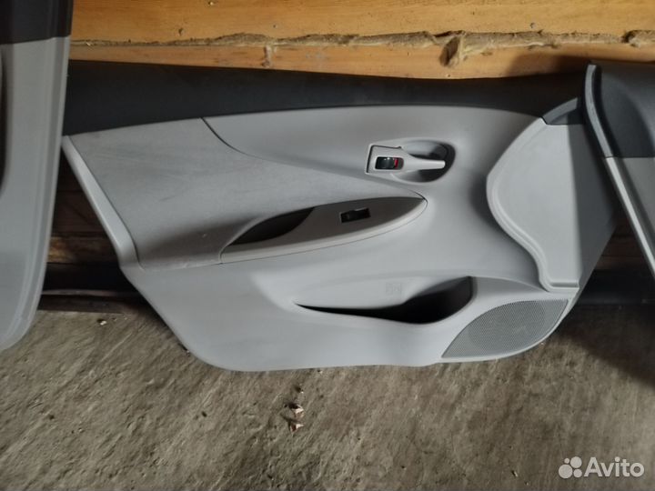 Дверные карты toyota corolla аксио 2010