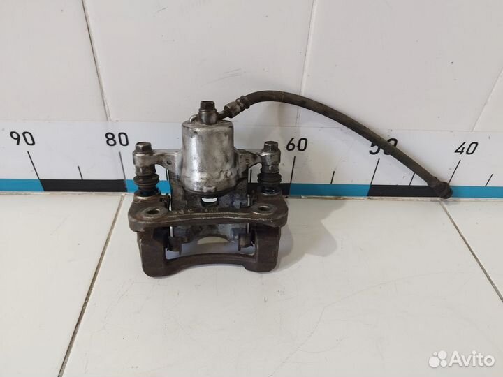 Суппорт тормозной задний правый ix35/Tucson 2010