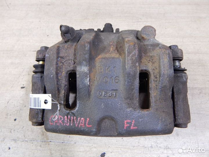 Суппорт тормозной передний левый Kia Carnival VQ