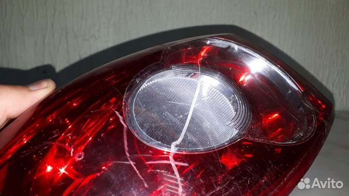 Фонарь задний левый Mazda Demio DBA-DY3W