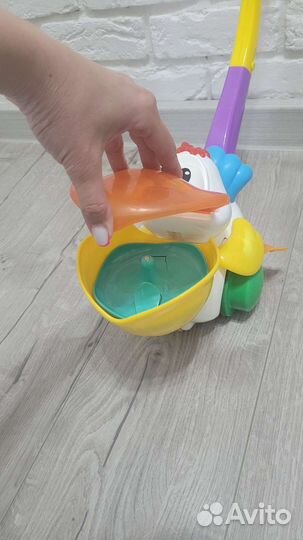 Каталка пеликан поющая