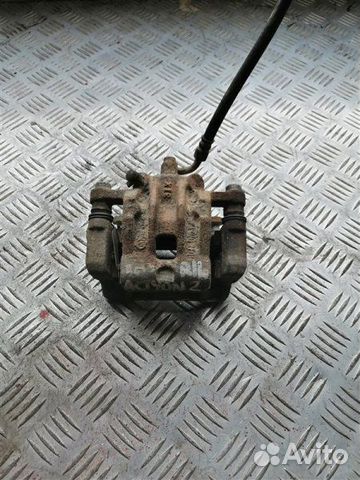 Суппорт тормозной задний левый Ssangyong Actyon