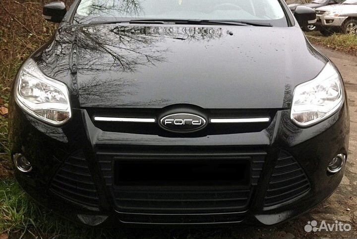 Наклейки на эмблемы Ford Focus