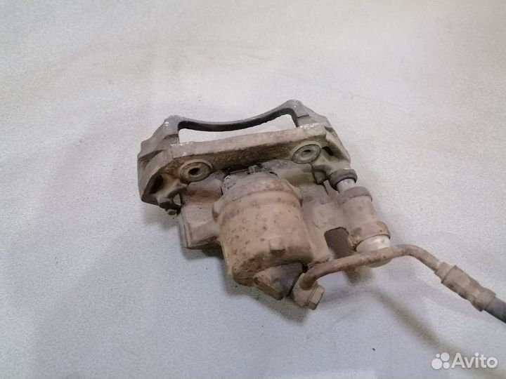 Суппорт тормозной передний левый Ford Escort 1989г