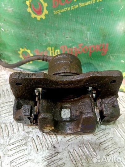 Суппорт передний левый Nissan Almera N 15 1.4 GAL