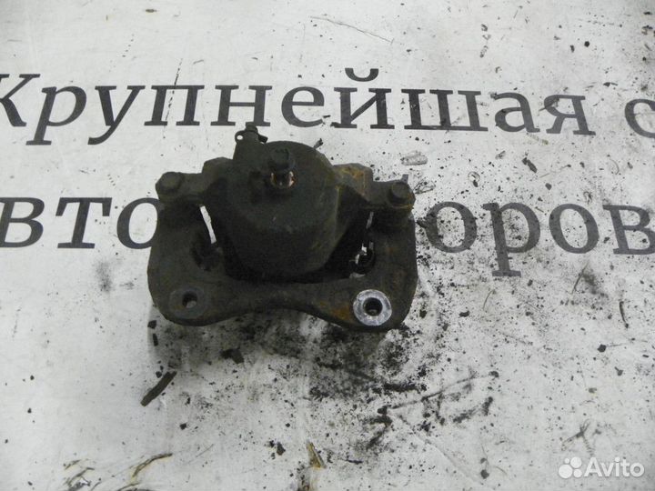 Суппорт тормозной передний левый Kia Sportage