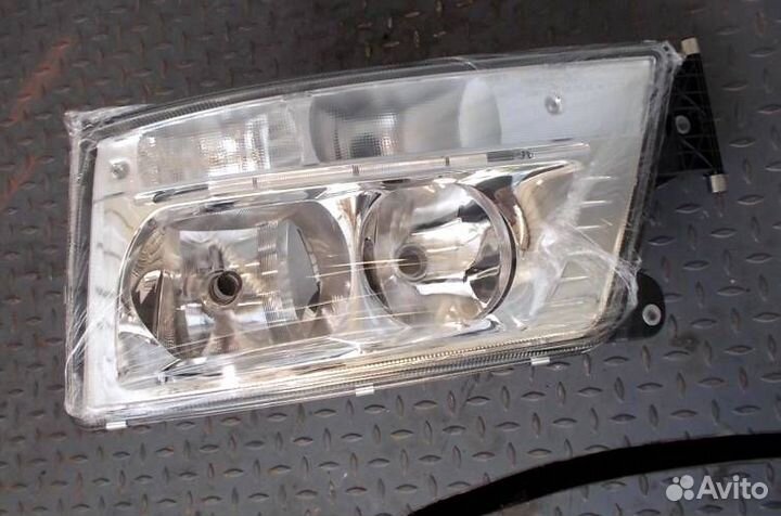 Фара левая MAN TGX TGS 4491102lmldem