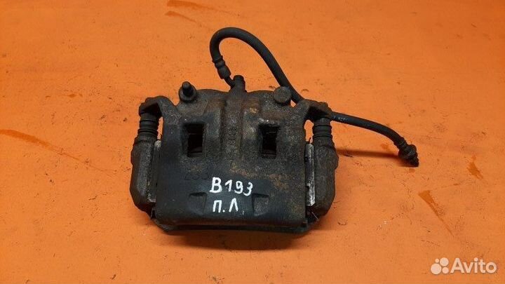 Суппорт тормозной передний левый Nissan Pathfinder