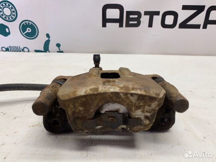 Суппорт тормозной задний левый Mitsubishi Lancer 9