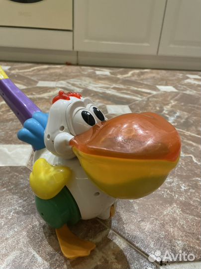 Игрушка каталка с ручкой Пеликан