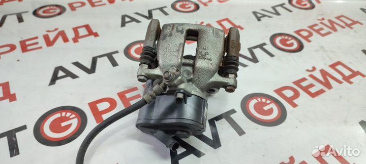 Суппорт тормозной задний левый Volkswagen Tiguan