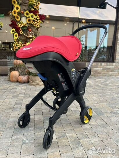 Продам автолюоьку коляску Doona