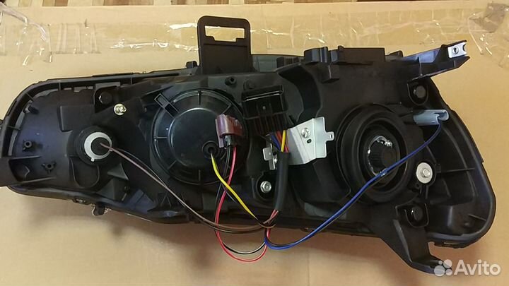 Фара левая Mitsubishi Lancer X