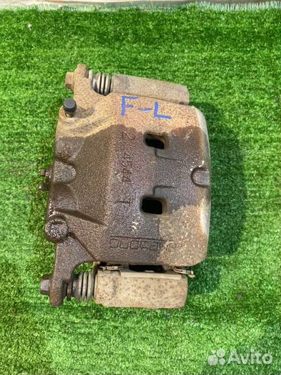 Суппорт тормозной (9) передний левый Nissan