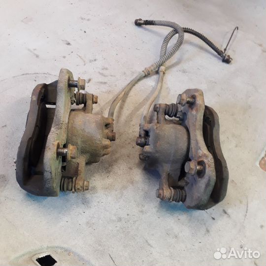 Суппорт передний левый правый Мицубиси Лансер 9