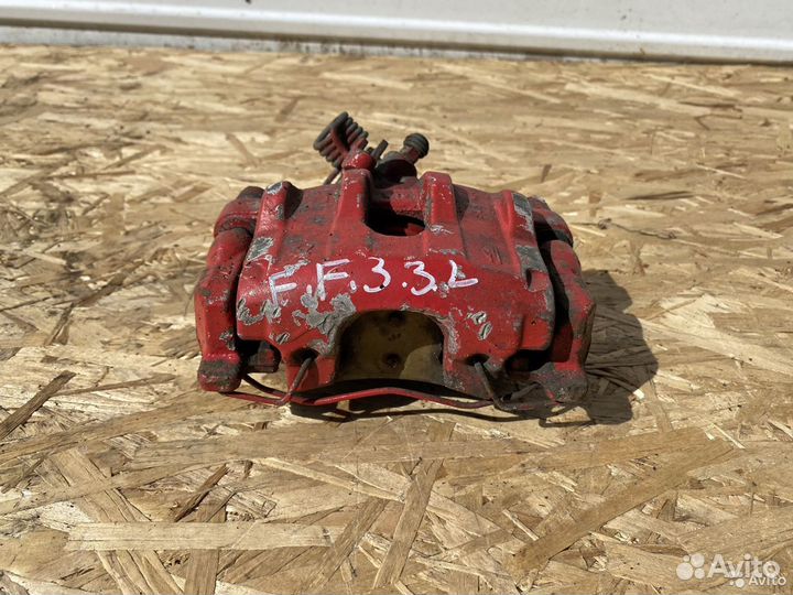 Тормозной суппорт задний левый Ford Focus 3