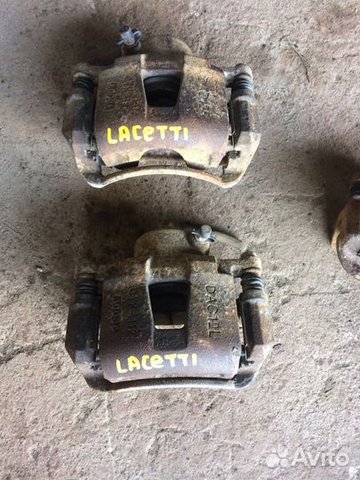 Суппорт передний Chevrolet Lacetti