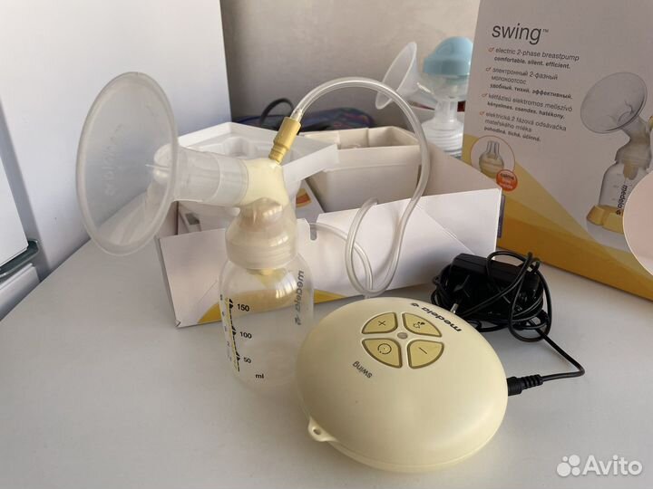 Молокоотсос medela электрический