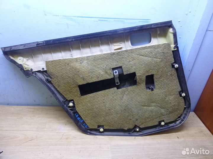 Обшивка двери задней правой Lancer Cedia