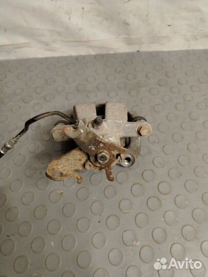 Суппорт задний правый Renault Fluence седан K4M