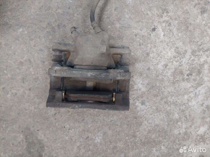 Суппорт левый правый Nissan Almera G15