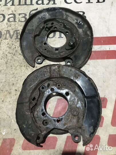 Щит опорный задний Nissan X-Trail II (2007—2011)