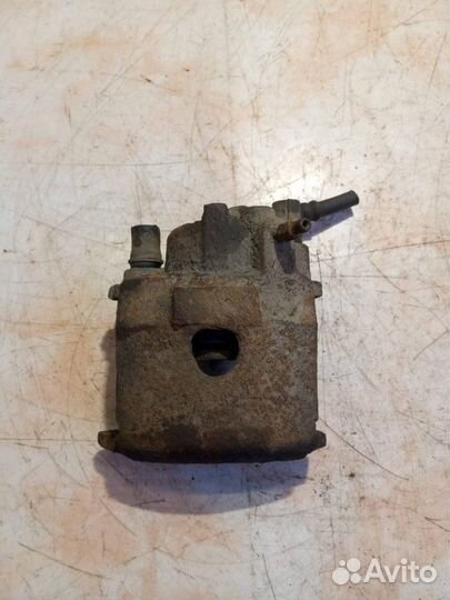 Суппорт тормозной передний левый Volkswagen Polo