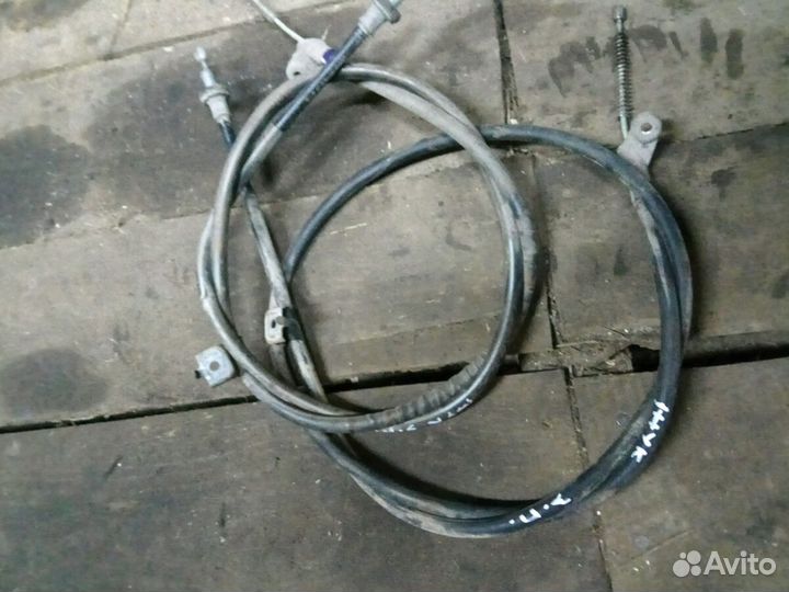 Трос ручного тормоза Ниссан Жук