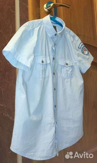 Рубашка голубая с коротким рукавом на мальчика 164