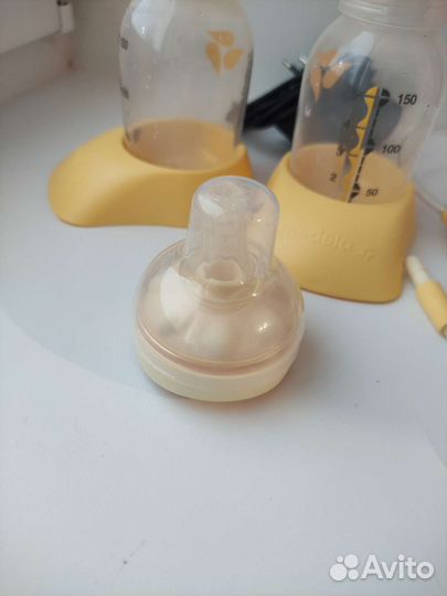 Молокоотсос Medela Swing Maxi & Calma двойной