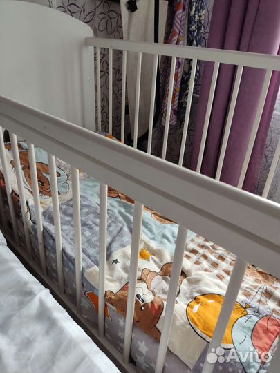 Детская кроватка с продольным маятником