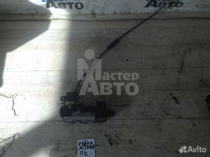 Замок двери передний Опель Астра Н