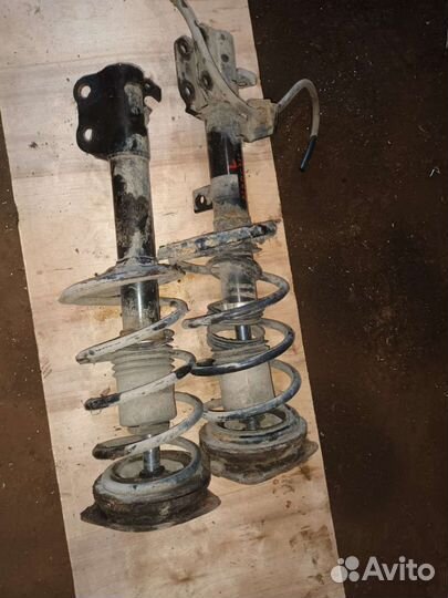 Стойка амортизатор передняя Nissan March K12