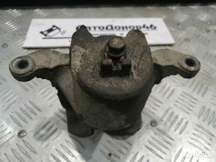 Суппорт тормозной передний левый Nissan Teana J31