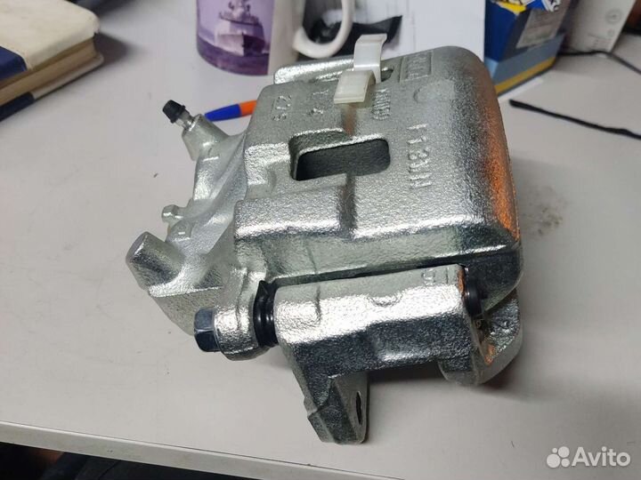 Суппорт левый mazda L20633990B