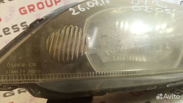 Фара головная DY L не рест б/у (черные очки) Demio