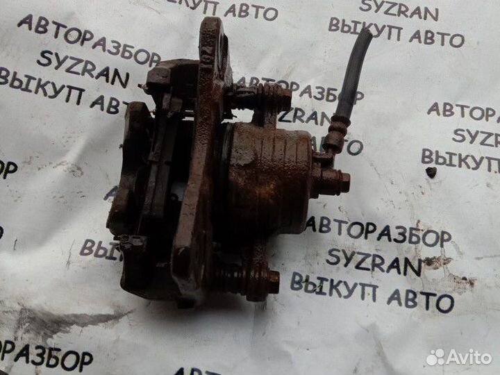 Суппорт левый Nissan Almera n15