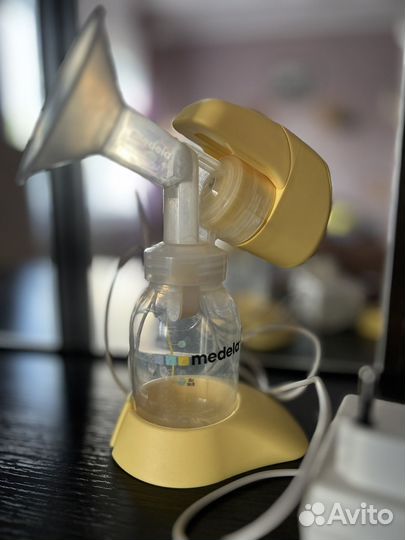 Молокоотсос medela электрический