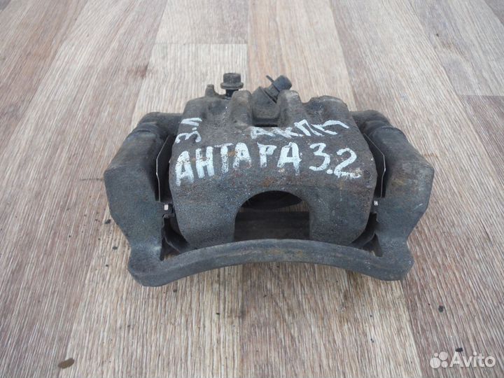 Суппорт тормозной задний левый opel Antara 2009