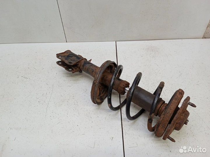 Амортизатор передний Mitsubishi Lancer 9 CS 1.6