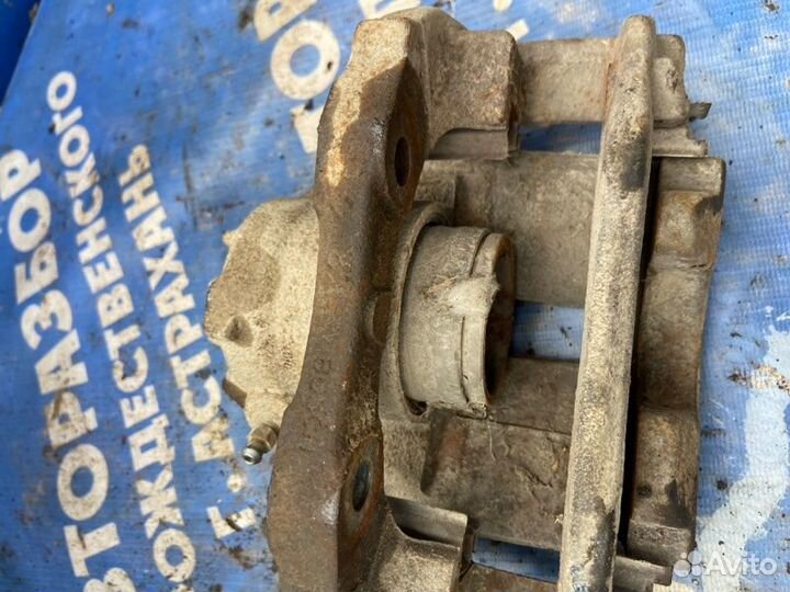 Передний левый суппорт. Peugeot Partner